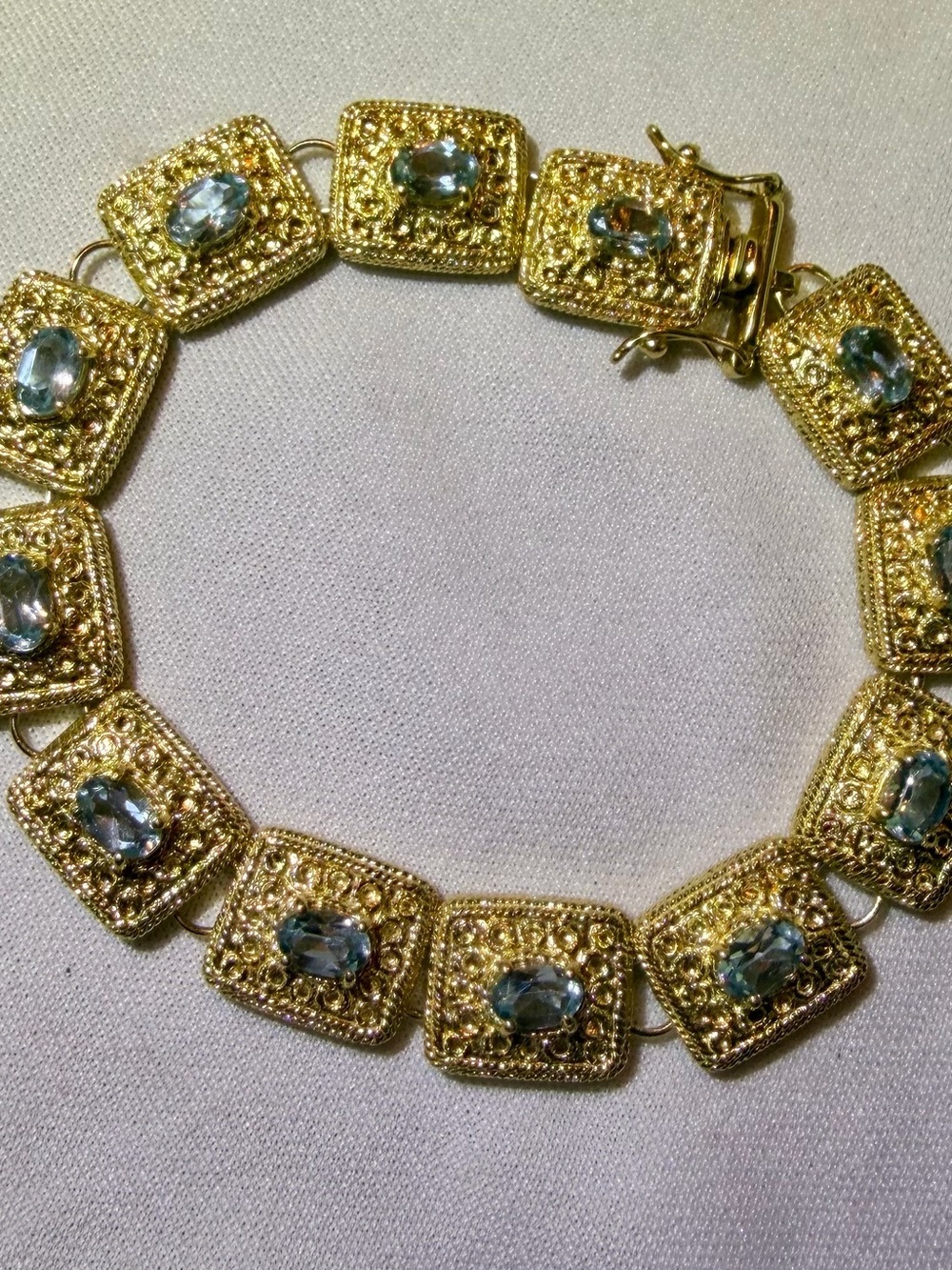 18K Yellow Gold Over Solid
Sterling Silver Swiss Blue Topaz 7.8 inch Bracelet